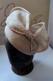 Cream hat/fascinator with bow, dotted with crystals