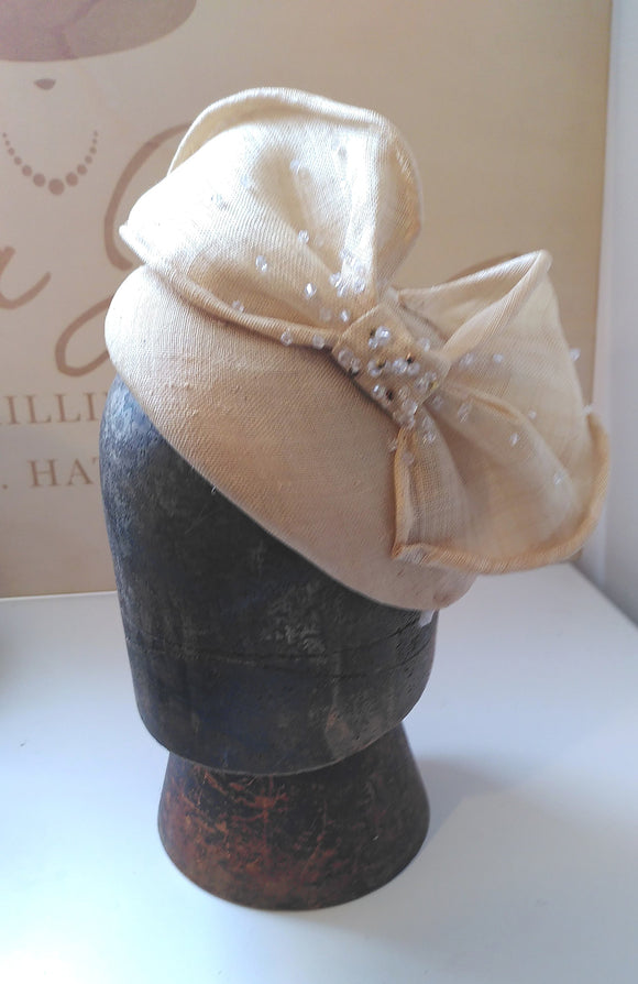 Cream hat/fascinator with bow, dotted with crystals