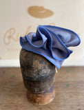 Blue straw sculptural hatinator/fascinator.