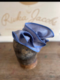 Blue straw sculptural hatinator/fascinator.