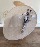 Cream saucer hat, with pink feathers, and cream twisted quills