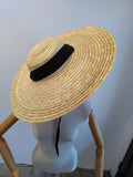 Straw sun hat with black ribbon