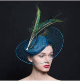 Peacock blue fascinator hat, with veil brim