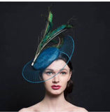Peacock blue fascinator hat, with veil brim