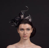 black and silver twisted fascinator with silver twirls, perfect for weddings and occasions