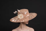blush pink, wide brimmed hat, with silk flowers and spray of feathers