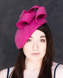 Shocking pink felt sculptural hatinator/fascinator.