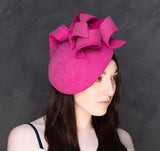 Shocking pink felt sculptural hatinator/fascinator.