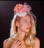 Pink bird cage veil, white lace base and pink rose fascinator. rivka jacobs millinery devon uk