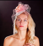 Pink bird cage veil, white lace base and pink rose fascinator. rivka jacobs millinery devon uk