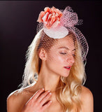 Pink bird cage veil, white lace base and pink rose fascinator. rivka jacobs millinery devon uk