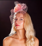 Pink bird cage veil, white lace base and pink rose fascinator. rivka jacobs millinery devon uk