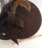 Brown felt beret with spray of feathers