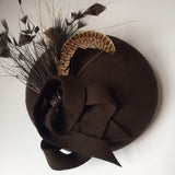 Brown felt beret with spray of feathers