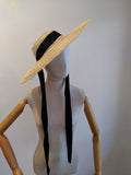 Straw sun hat with black ribbon