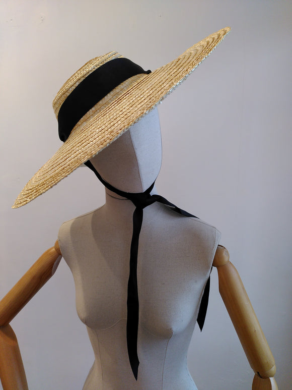 Straw sun hat with black ribbon