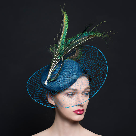 Sea Blue button beret, with blue veil stretch brim and peacock feathers.