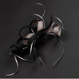 black and silver twisted fascinator with silver twirls, perfect for weddings and occasions