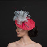 Pink fascinator with oversized grey bow with pink and grey quills