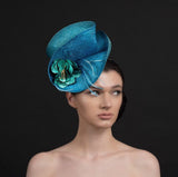 Turquoise blue fascinator, with blue leather rose and spray of feathers, perfect for ascot and weddings