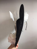 Large black and white saucer hat, with big white silk rose and 3 white arrow feathers