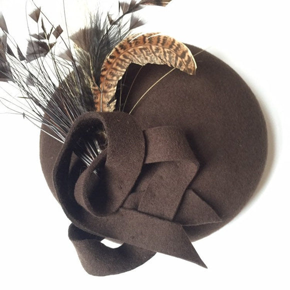 Brown felt beret with spray of feathers