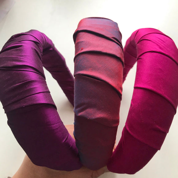 Silk padded in hairbands. In red, purple and pink