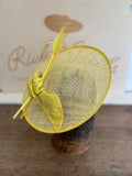Sunny yellow saucer hat with silk bow and feathers